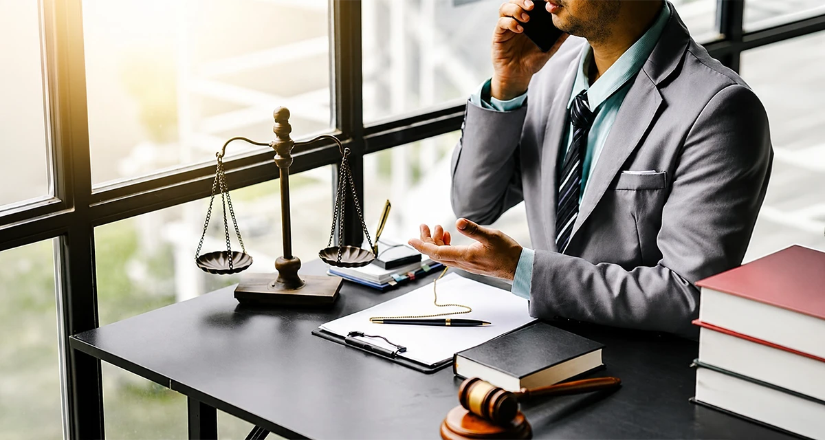Business professional reviewing legal paperwork for Legal Documents Translation and risk management